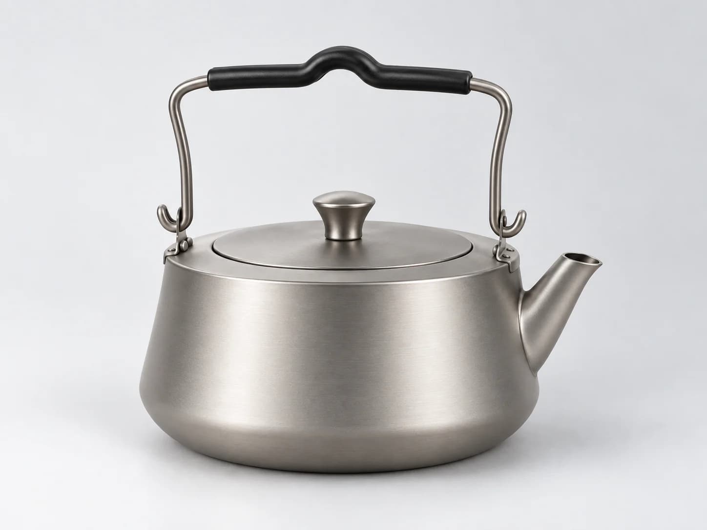 AI-generated illustrative visual of a metal kettle with bail handle on a light neutral background