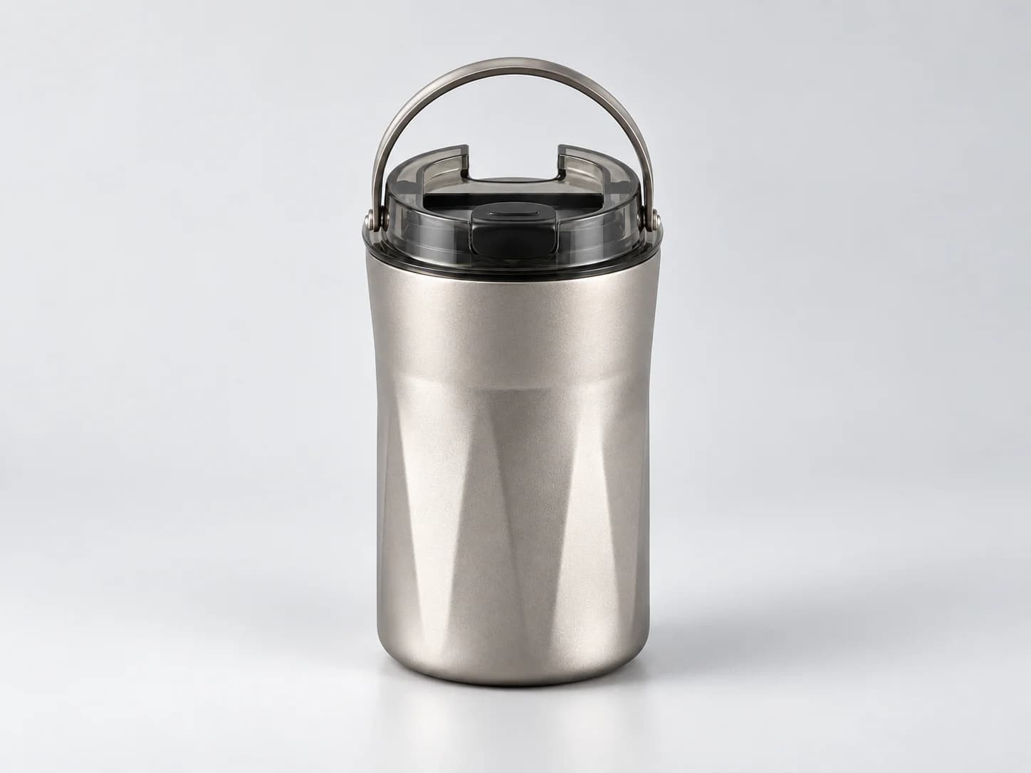 AI-generated illustrative visual of a metal vacuum cup with transparent lid and carry loop