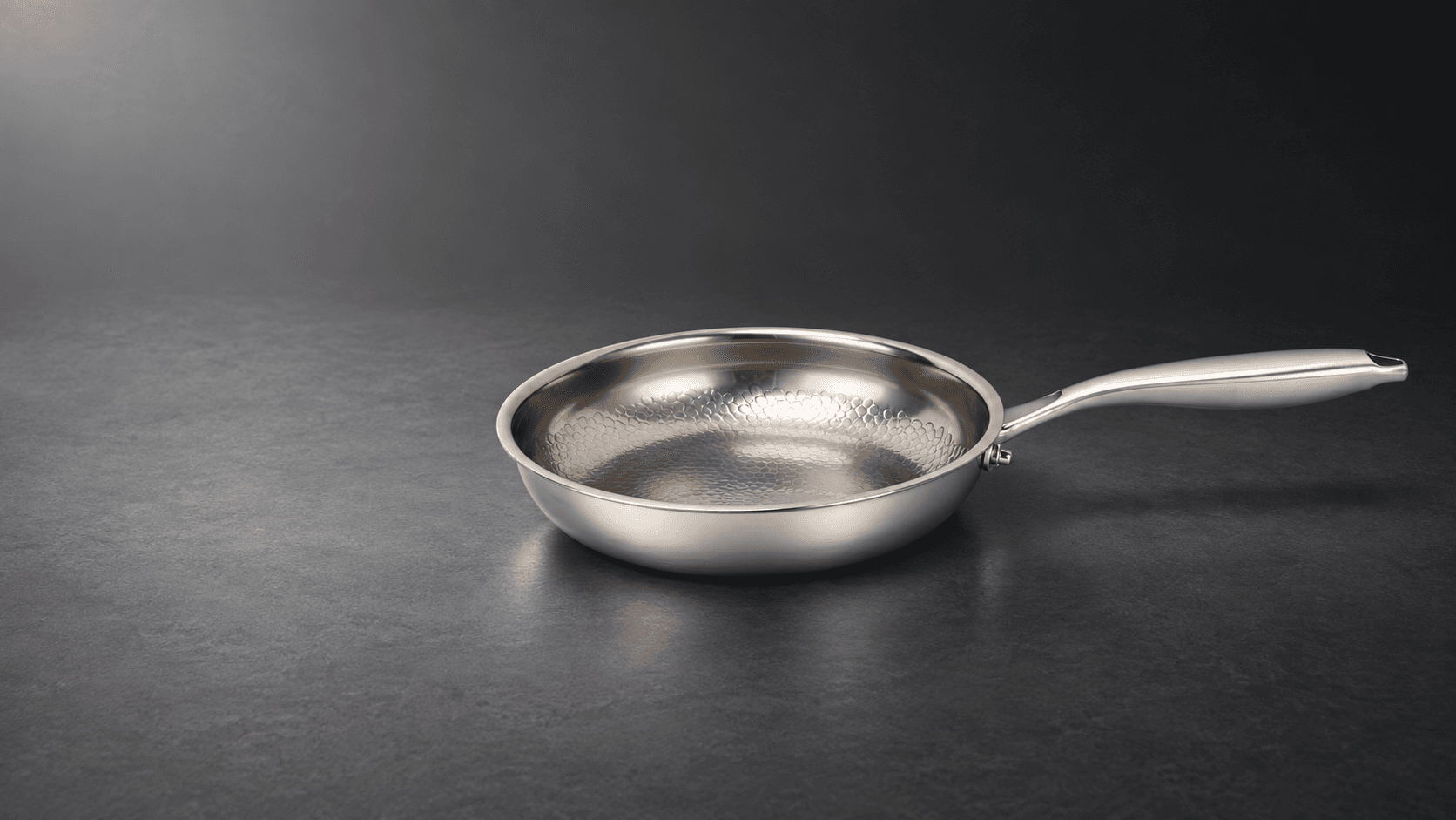 Custom titanium pan reference on a graphite studio surface