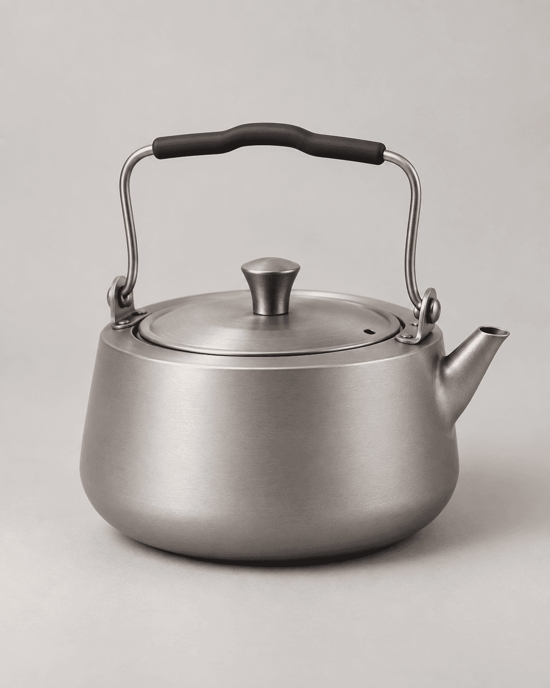 Titanium camping kettle with catalog-referenced bail handle